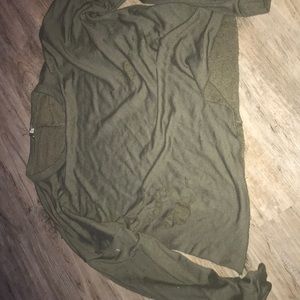 green cropped top with holes